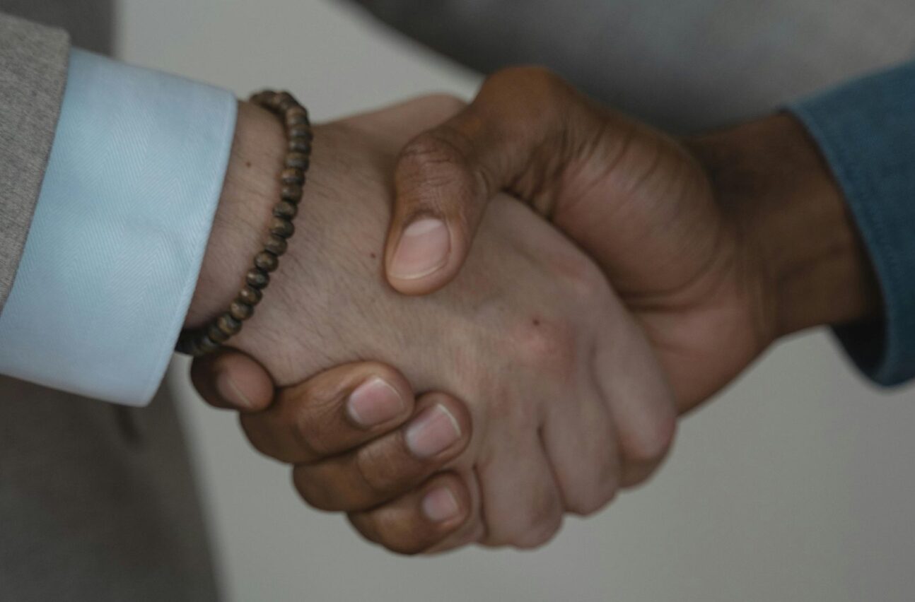 This discussion paper explores how public-private partnerships (PPPs) can strengthen research and innovation (R&I) in sub-Saharan Africa (SSA). It focuses on the role of Science Granting Councils (SGCs), which fund and manage research efforts in various African countries. 
Overview 
PPPs in R&I involve collaboration between governments, private companies, and research institutions. These partnerships aim to solve real-world problems by combining public funding with private expertise. In SSA, most countries have low R&D investment, averaging around 0.5% of their GDP.
SGCs play a central role in funding research, building capacity, and linking public and private actors. African countries have diverse SGC structures depending on their history and institutional setup. Many PPPs in Africa are focused on agriculture and health, areas of high social and economic need.
Key points on public-private partnerships from the paper
Challenges of PPPs include weak infrastructure, limited private sector involvement, and fragmented collaboration. There’s a need for better alignment between universities and industry priorities. Many African universities need stronger ties with industry and better performance in global rankings.
Trust and long-term commitment are essential for successful partnerships. Strong legal frameworks help manage issues like intellectual property rights and revenue sharing. Innovation systems should include policies, institutions, and people working together. Proximity between research institutions and businesses helps with collaboration.
Case studies from Europe, India, and the US show the importance of formal contracts, shared goals, and flexible governance. The COMET (Austria) and Research Campus (Germany) models highlight how PPPs can thrive with government support. However, African contexts require tailored PPP models, not direct copies from developed nations.
Innovation should be viewed as a cycle, instead of a linear process, feedback and learning are key. Good PPPs have clear roles, shared risks, and joint monitoring systems. Training and capacity building are essential to improve institutional effectiveness. Sustainable partnerships should focus on long-term development, not just short-term projects.
Local knowledge plays a big role in African innovation but is underrecognized. There’s a push to move beyond donor-driven projects towards locally owned initiatives. SGCs can act as intermediaries, connecting diverse stakeholders and managing joint funding.
Summary 
The paper finds that public-private partnerships can help African countries strengthen their research and innovation systems, but several challenges stand in the way. Science Granting Councils are well-positioned to lead these efforts, but need supportive policies, clear legal frameworks, and active engagement with both public and private sectors.