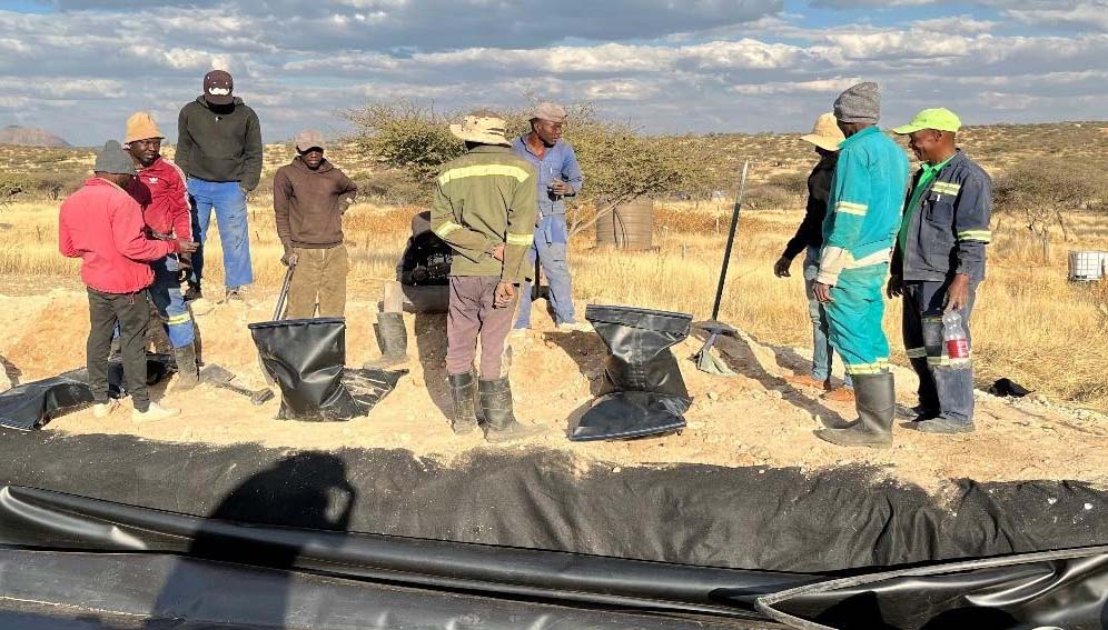Community members onsite during biogas system installation.